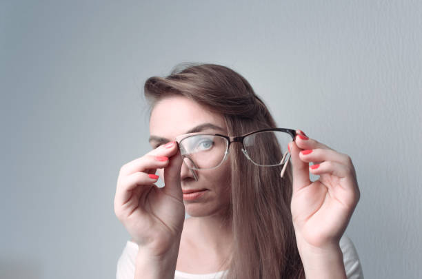 istock Young woman is watching through glasses 638951454