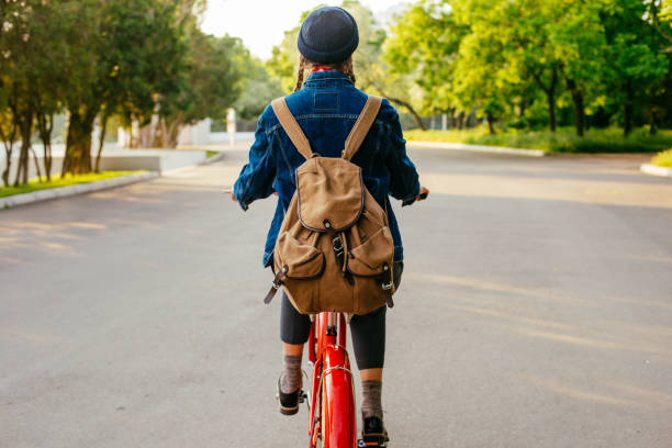 istock female riding vintage bicycle in park 638952016