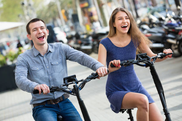 istock Happy young man and woman with electrkc bikes 638952064