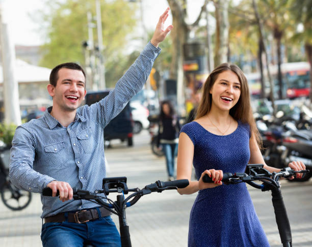 istock Happy young man and woman with electrkc bikes 638952216