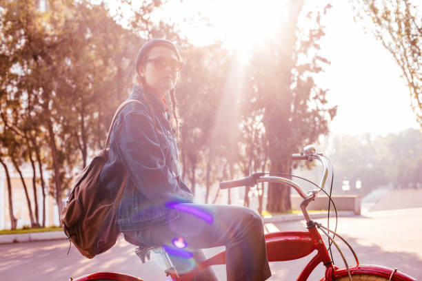 istock female riding vintage bicycle in park 638952312