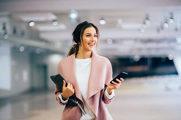 istock Happy beautiful woman texting 638952604