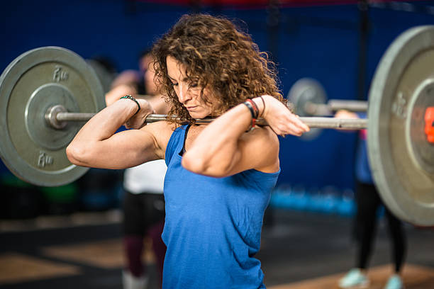 strong woman weightlifting a barbell