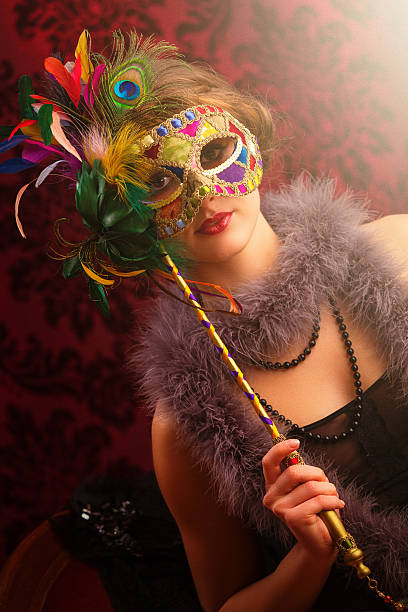 istock young woman with masquerade mask 638953186