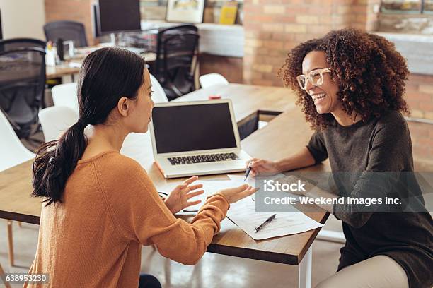 Discussing The New Marketing Strategy Stock Photo - Download Image Now - Advice, Role Model, Business