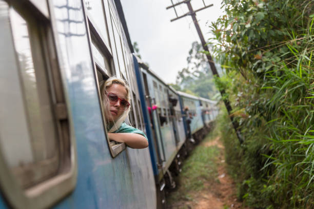istock Blonde caucasian woman riding a train, looking trough window. 638958142