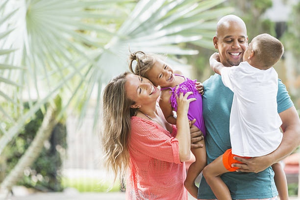 istock Happy mixed race family on tropical vacation 638958504
