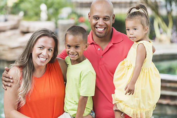 istock Mixed race family with two young children 638958558