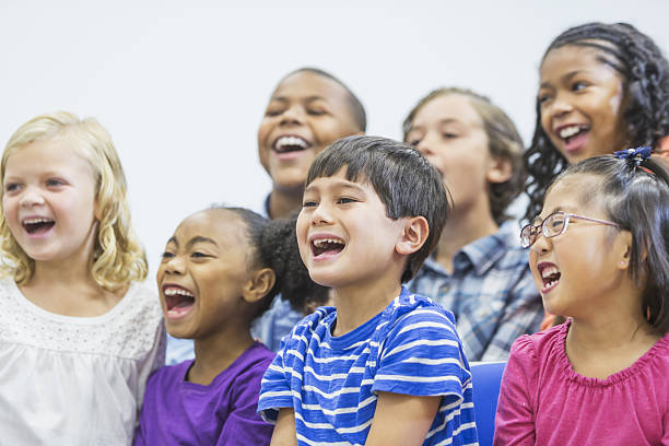 istock Multi-ethnic group of children sitting together shouting 638958768