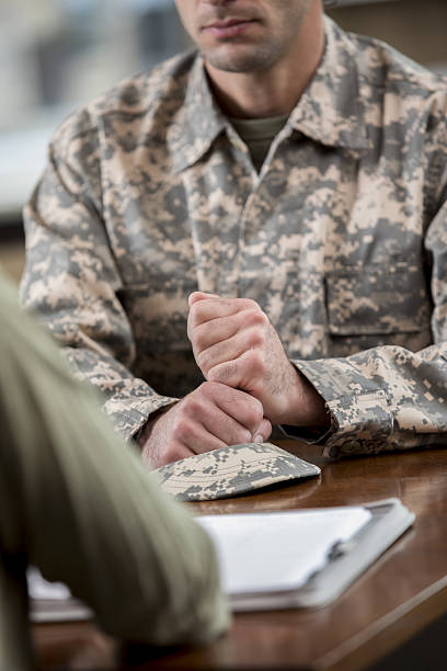 istock Depressed army veteran attends counseling session 638959810