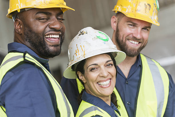 istock Woman with diverse group of construction workers 638960222