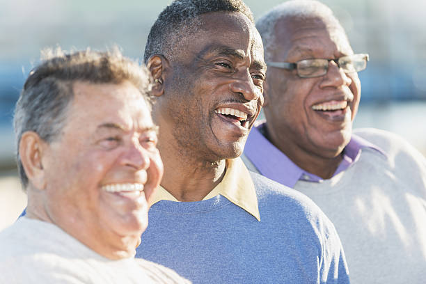 istock Faces of three multi-ethnic senior men laughing 638962782