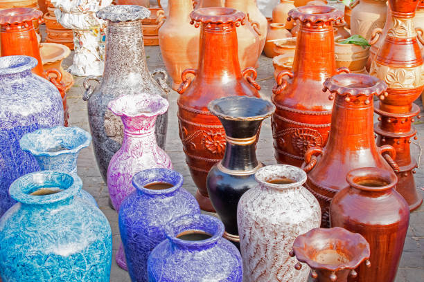 Colourful flower vases made of clay. Handicrafts on display during the Handicraft Fair in Kolkata , earlier Calcutta, West Bengal, India. It is the biggest handicrafts fair in Asia.