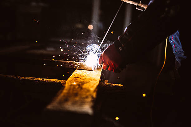 istock Close-up of a welder wielding sparks 638963974
