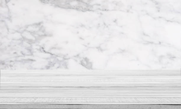 istock White wooden counter top with defocus marble backgrounds 638966322