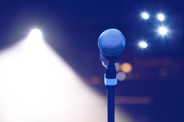 istock microphone on the background of dark hall and soffits. Soft 638969730