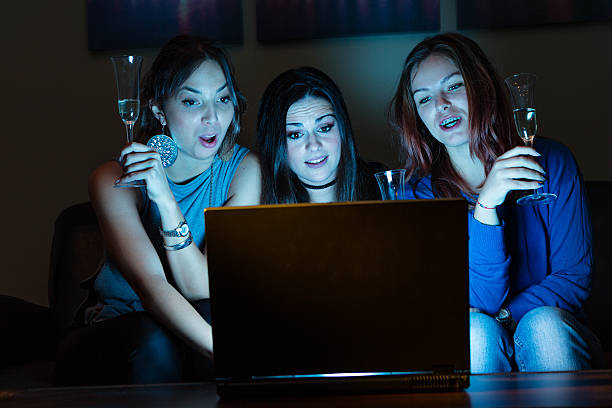 istock Three girlfriends, drunk, drinking champagne, celebrating, watch 638975906