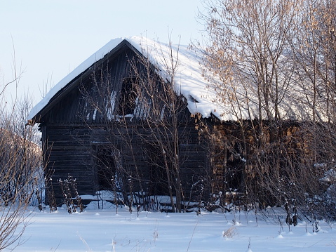 The old wooden abandoned house in the village
