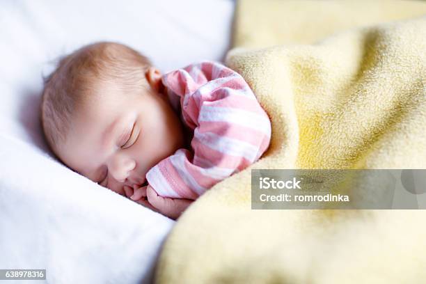 Portrait Of Cute Adorable Newborn Baby Girl Sleeping Stock Photo - Download Image Now