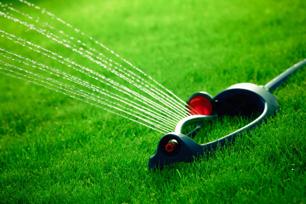 istock Lawn sprinkler spaying water over green grass. 638978332