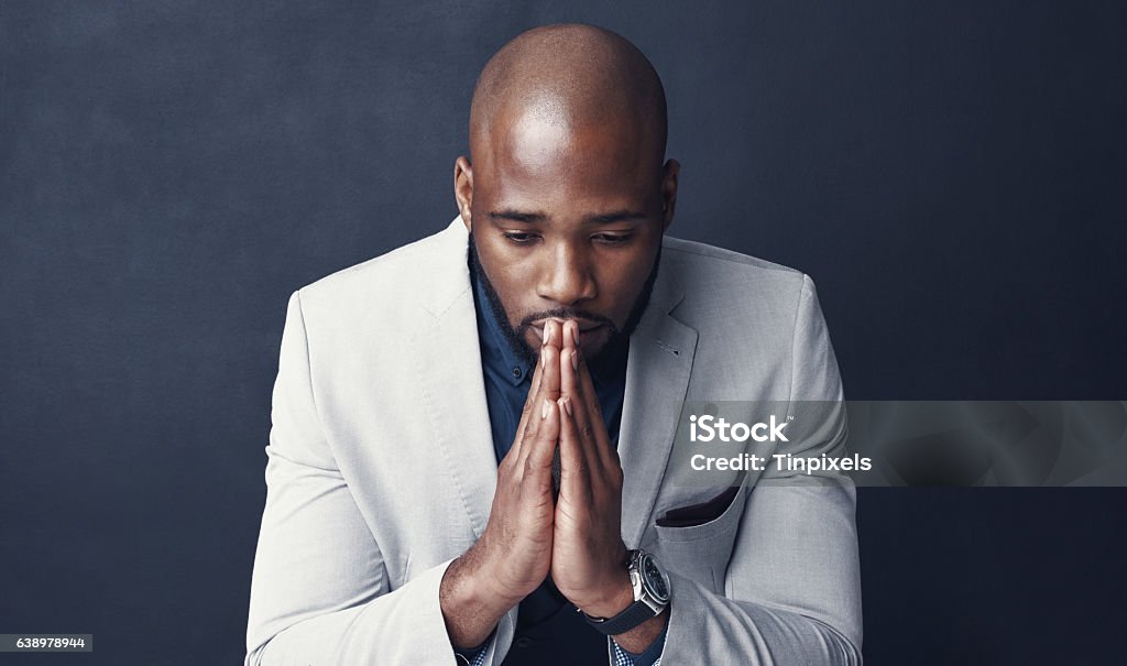 Success is defined by our choices decisions Studio shot of a businessman looking worried against a gray background African-American Ethnicity Stock Photo