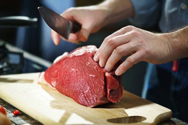 istock Cook with a piece of meat 638979018