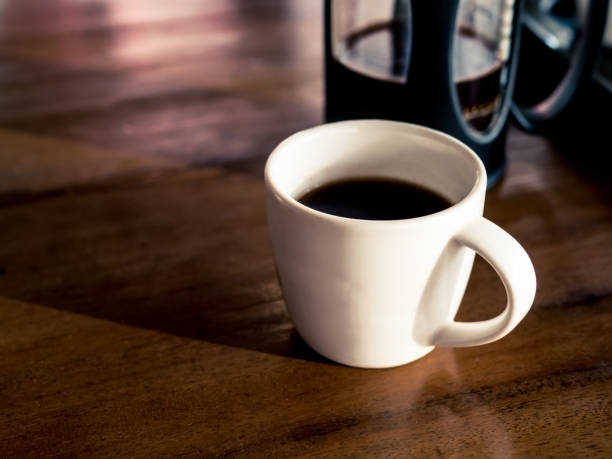 istock French coffee press with freshly brewed coffee, on wood table 638979950