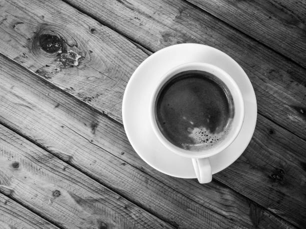 istock Americano coffee, on wood table, black and white tone 638980004