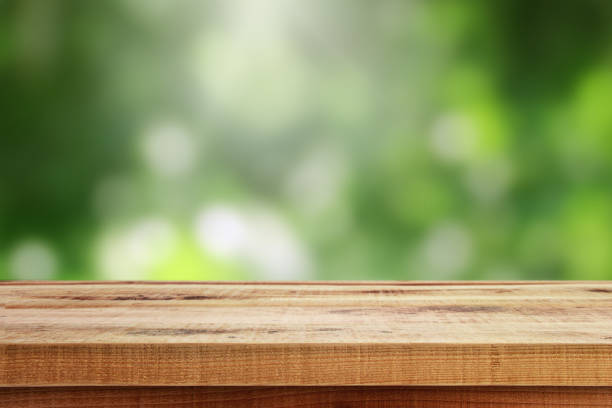istock Wooden table and blur green background. 638982696