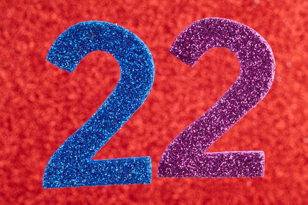 istock Number twenty-two blue purple over a red background. Anniversary 638982964