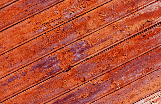 istock Weathered orange painted wooden wall texture. 638984252