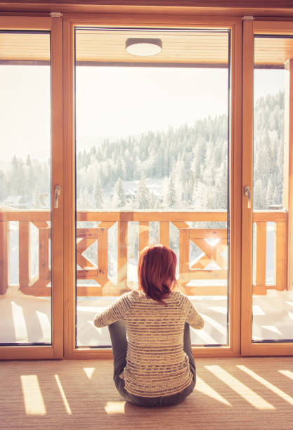 istock Woman sitting in a comfortable chair drinking coffee at home. 638986608