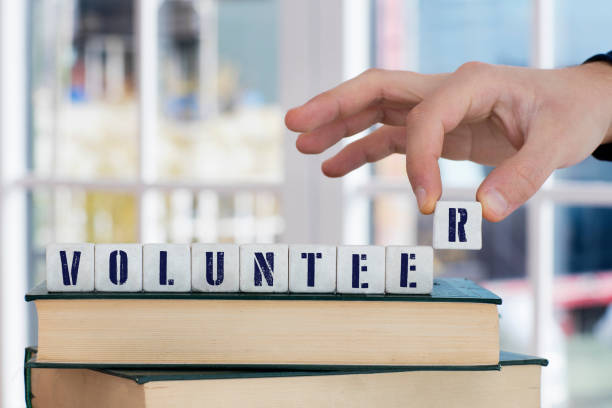 istock VOLUNTEER Concept , Hand with alphabet blocks 638987126