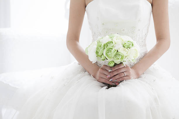 The bride has a bouquet of flowers.
