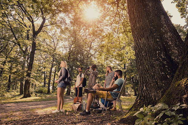 istock Group of young people looking for place to set camp. 638988930