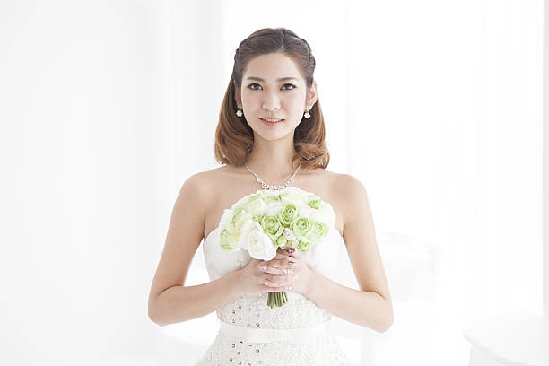 istock Close-up of a bride with a green bouquet. 638989710