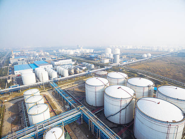 istock oil containers in modern refinery plant in blue sky 638993144