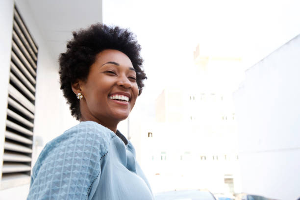 istock Young black woman standing outdoors and smiling 638993276
