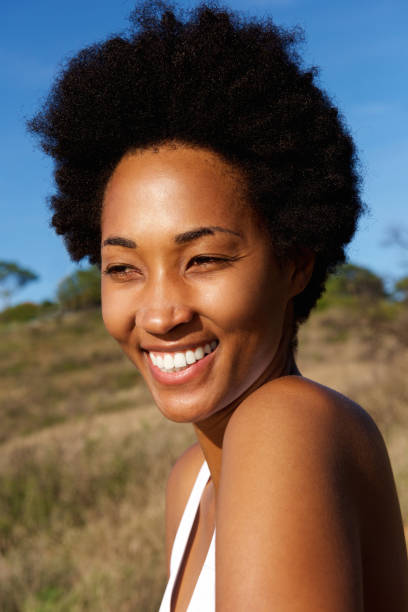 istock Cheerful young female runner outdoors in field 638995988