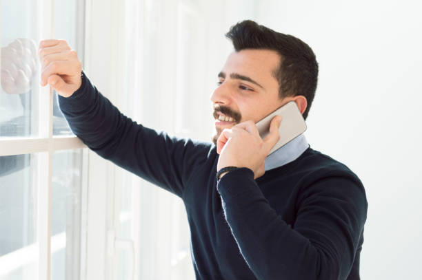 istock Cool young business man on the phone 638997818