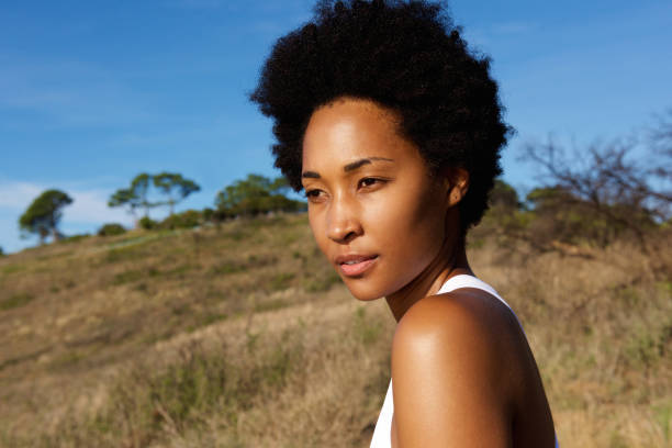 istock Young african female outdoors in field 638997948