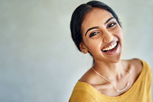 I choose happiness because it feels great Portrait of an attractive and happy young woman posing in the studio indian woman laughing stock pictures, royalty-free photos & images
