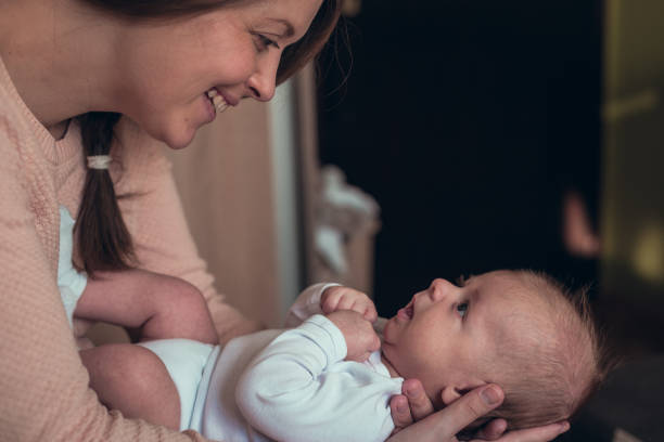 istock Baby playing in a mommys arms 638999744