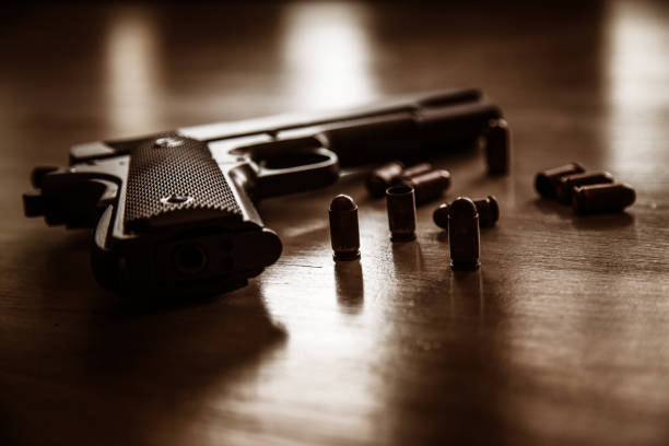 Old world war 2 pistol Old world war 2 pistol with bullets on wooden table forty five caliber handgun stock pictures, royalty-free photos & images