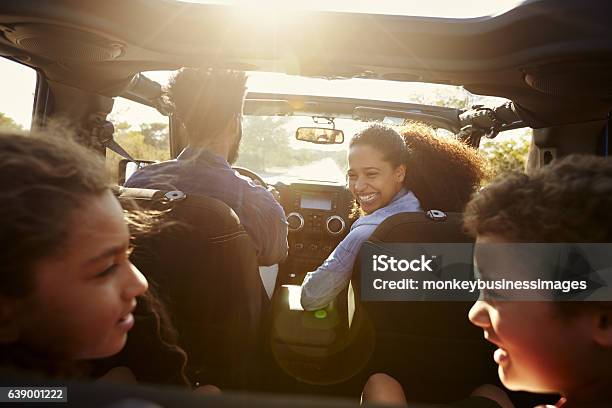 Happy Family On A Road Trip In Their Car Rear Passenger Stock Photo - Download Image Now