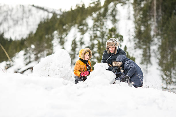 istock Family making snowman 639002246