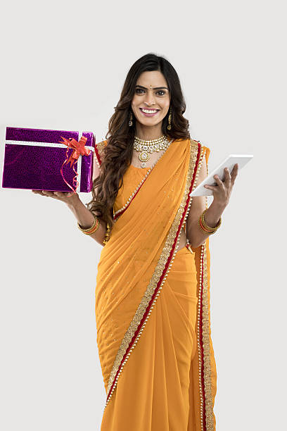 istock Woman holding gift box and digital tablet 639002990