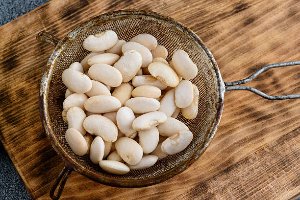istock Wet white beans in sifter 639003092