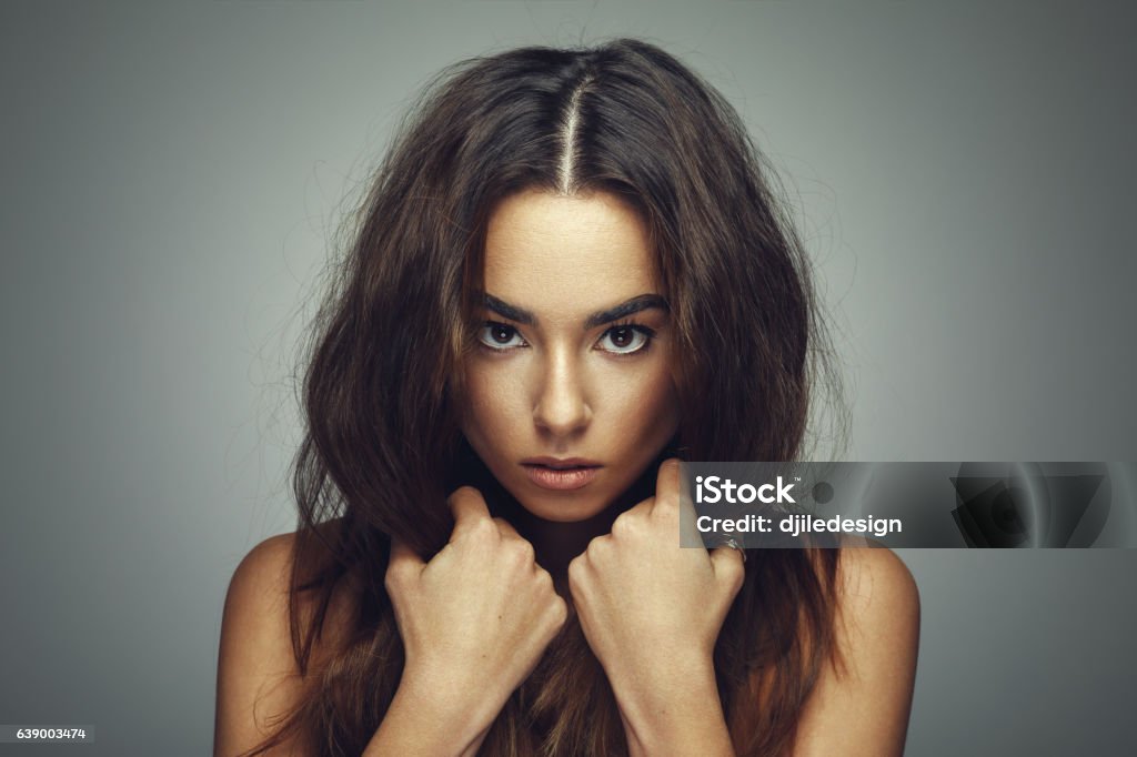 Beauty portrait of young woman with long hair in studio Adult Stock Photo