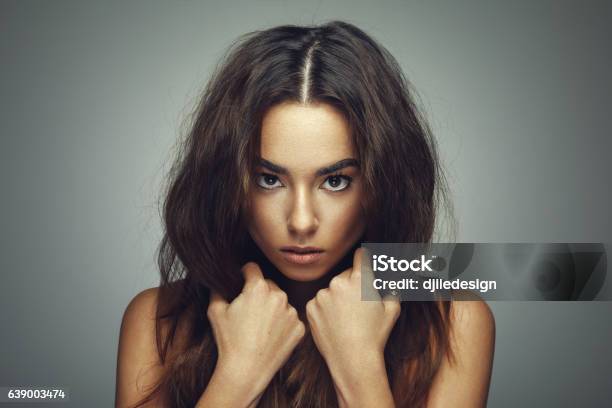 Beauty Portrait Of Young Woman With Long Hair In Studio Stock Photo - Download Image Now